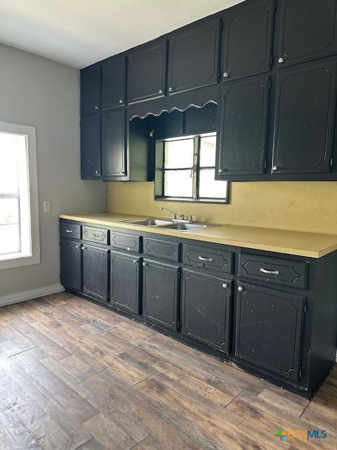 101 S Vine St, Victoria, TX 77901 - kitchen with light wood-style flooring and light countertops