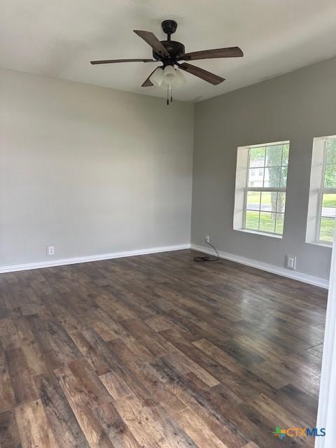101 S Vine St, Victoria, TX 77901 - empty room featuring dark wood-style floors and a ceiling fan