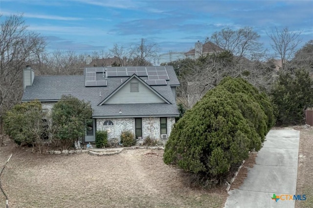 view of front of property with solar panels