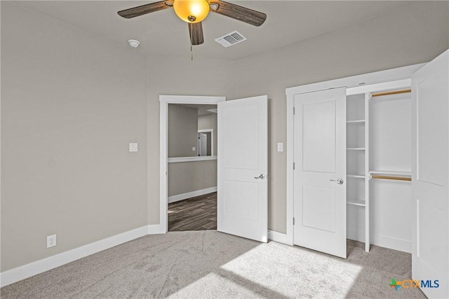 unfurnished bedroom with a closet, ceiling fan, and carpet