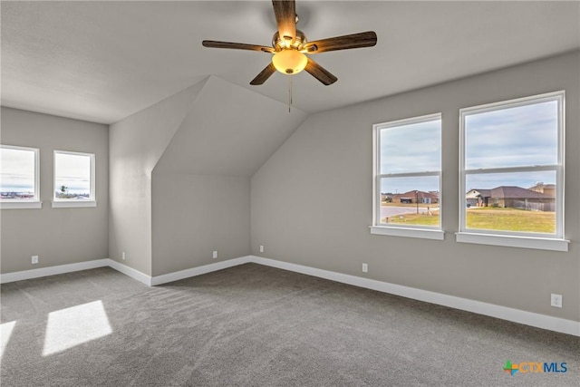 bonus room featuring ceiling fan, lofted ceiling, and carpet flooring