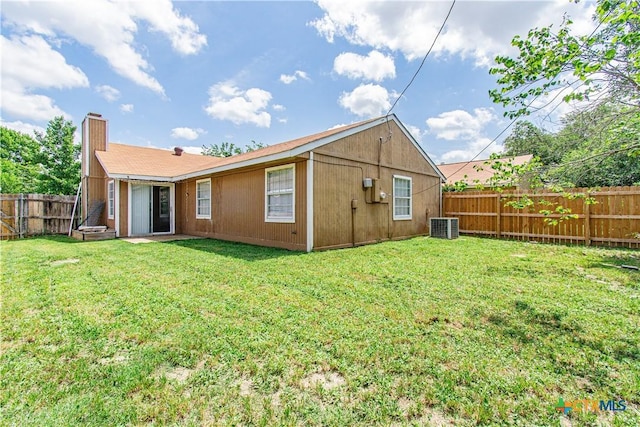 2709 San Jacinto Rd, Temple, TX 76502 - back of property with central AC unit and a chimney