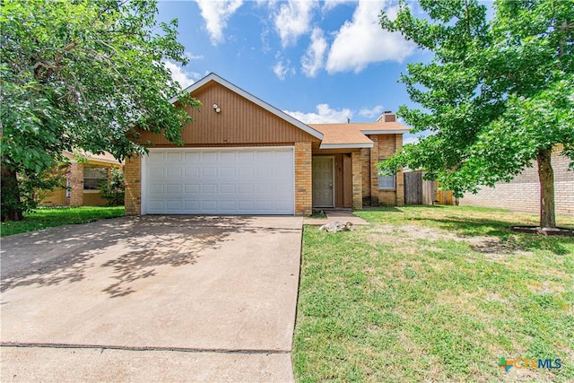 2709 San Jacinto Rd, Temple, TX 76502 - view of front of house featuring driveway, brick siding, an attached garage, and a chimney