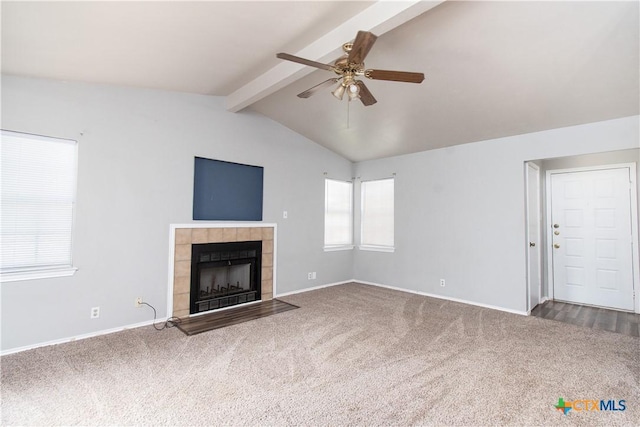 2709 San Jacinto Rd, Temple, TX 76502 - unfurnished living room with carpet, a ceiling fan, a tile fireplace, and baseboards