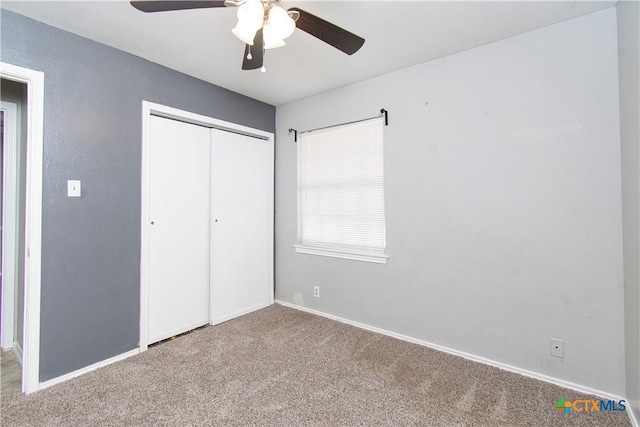 2709 San Jacinto Rd, Temple, TX 76502 - unfurnished bedroom featuring carpet floors, a closet, baseboards, and a ceiling fan