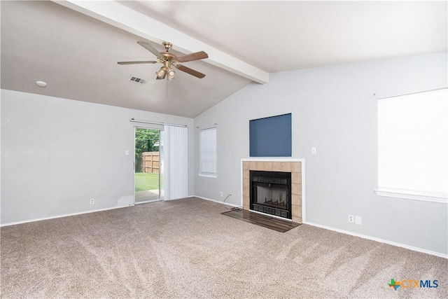 2709 San Jacinto Rd, Temple, TX 76502 - unfurnished living room featuring a ceiling fan, carpet flooring, a tile fireplace, and baseboards
