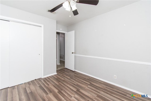 2709 San Jacinto Rd, Temple, TX 76502 - unfurnished bedroom featuring wood finished floors, a closet, ceiling fan, and baseboards