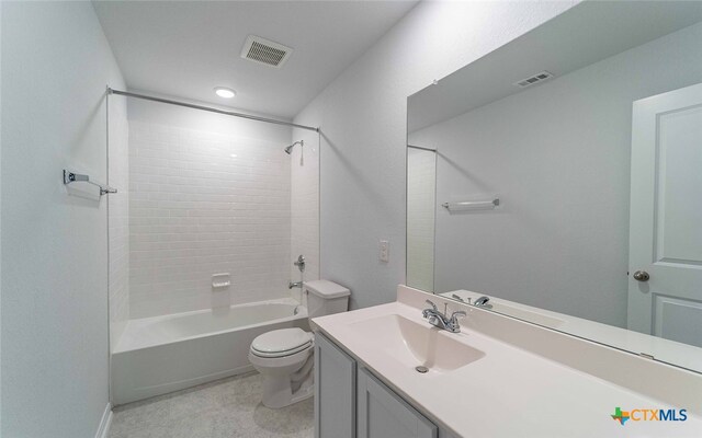 bathroom featuring toilet, bathtub / shower combination, vanity, and visible vents