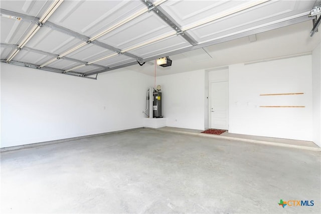 garage with water heater and a garage door opener