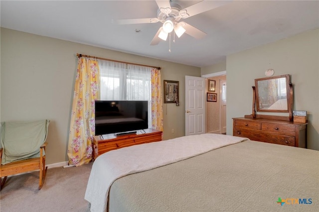 bedroom featuring baseboards, a ceiling fan, and carpet floors