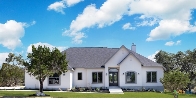 french provincial home featuring a front lawn