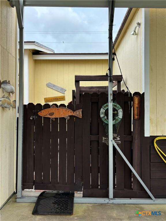 604 N 14th St, Port Oconnor, TX 77982 - doorway to property with a gate