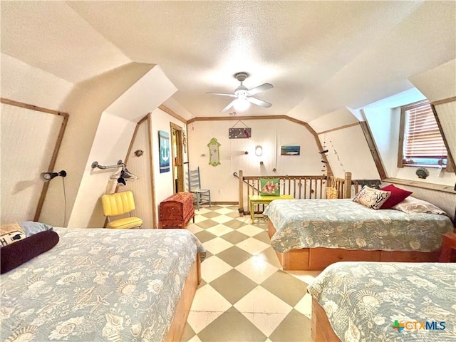 604 N 14th St, Port Oconnor, TX 77982 - bedroom featuring tile patterned floors, lofted ceiling, and a textured ceiling