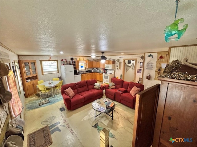 604 N 14th St, Port Oconnor, TX 77982 - living area with a textured ceiling, concrete flooring, and a ceiling fan