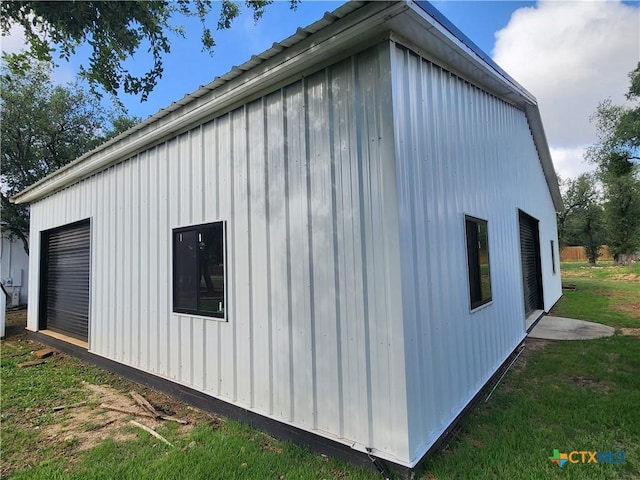102 County Road 180, Leander, TX 78641 - view of side of home with a garage and board and batten siding