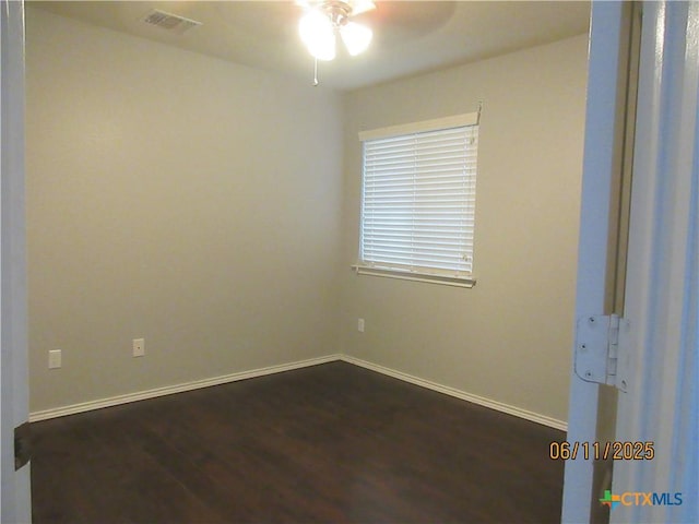 1418 Fawn Lily Dr, Temple, TX 76502 - spare room featuring a ceiling fan and dark wood finished floors