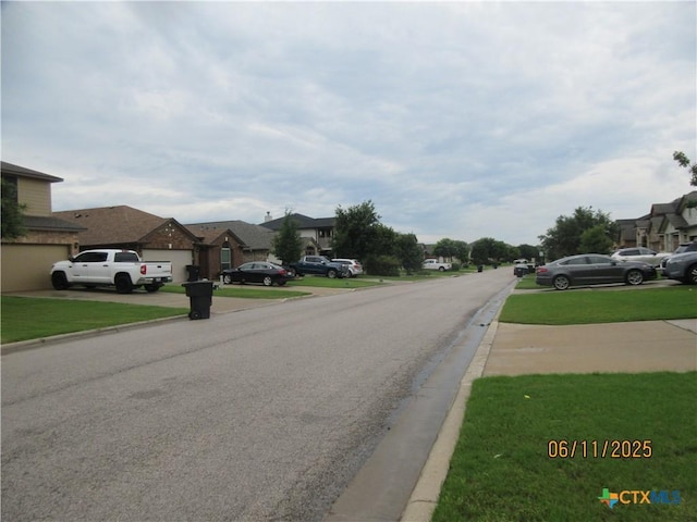 1418 Fawn Lily Dr, Temple, TX 76502 - view of asphalt road with a residential view and curbs