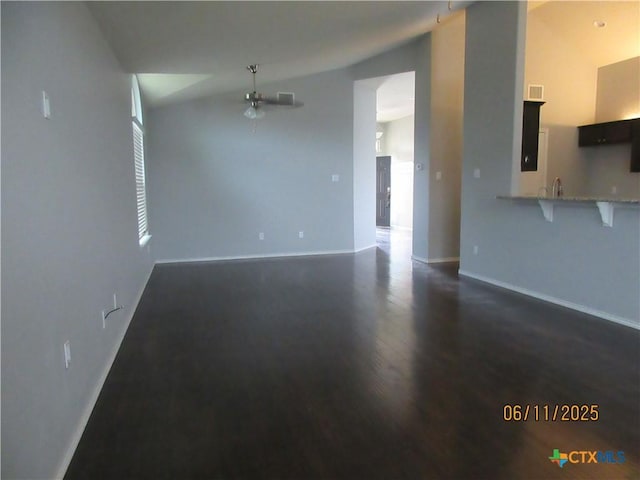 1418 Fawn Lily Dr, Temple, TX 76502 - unfurnished living room with lofted ceiling, a ceiling fan, and dark wood-style flooring