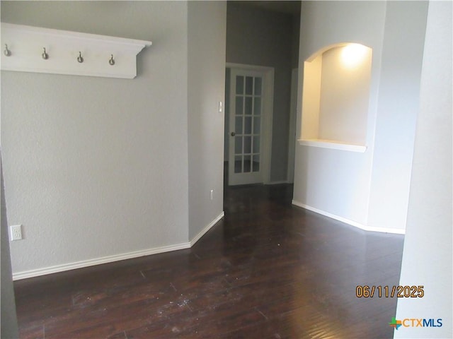 1418 Fawn Lily Dr, Temple, TX 76502 - empty room featuring wood finished floors and arched walkways