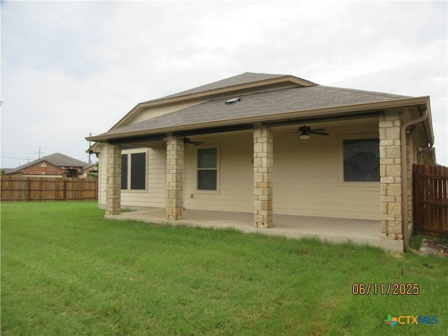 1418 Fawn Lily Dr, Temple, TX 76502 - back of property featuring a ceiling fan, roof with shingles, a patio, and stone siding
