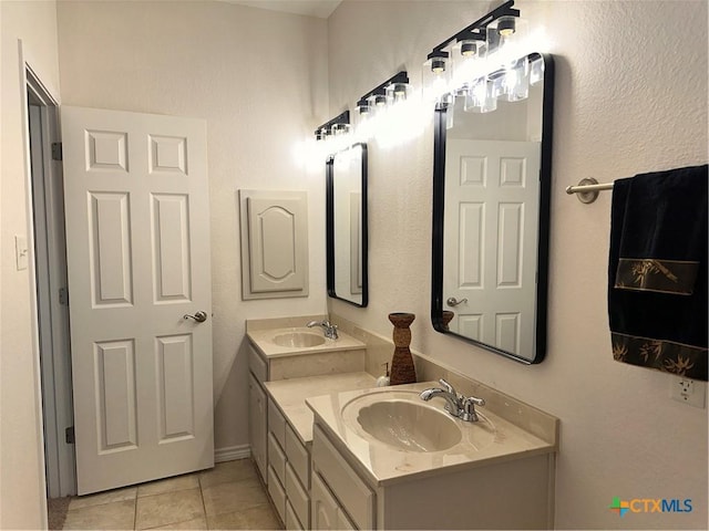 1004 Shady Hollow Ct, Nolanville, TX 76559 - bathroom featuring double vanity and tile patterned flooring