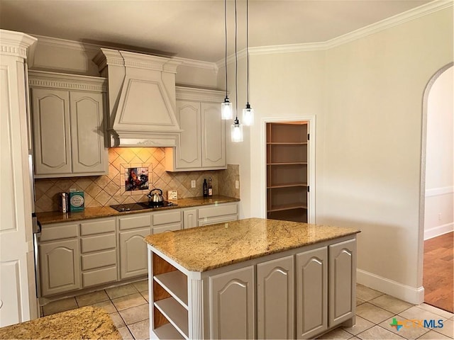 1004 Shady Hollow Ct, Nolanville, TX 76559 - kitchen with premium range hood, open shelves, backsplash, a center island, and light stone counters