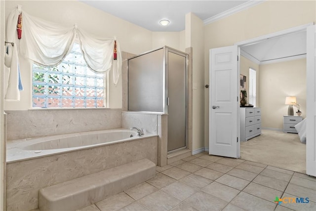 bathroom featuring ornamental molding, tile patterned flooring, a shower stall, and a bath