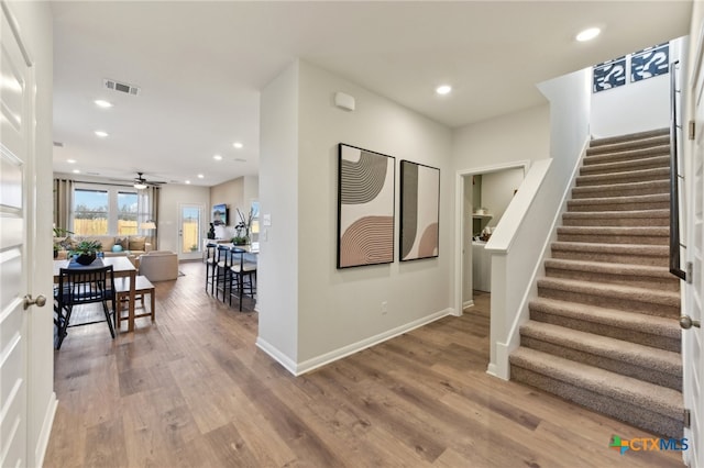 205 Firefox Way, Jarrell, TX 76537 - entrance foyer featuring stairs, ceiling fan, wood finished floors, and recessed lighting