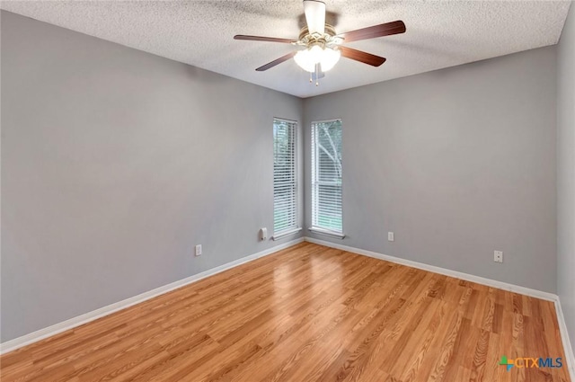 106 Hamlet Ct, Victoria, TX 77901 - unfurnished room with a textured ceiling, light wood finished floors, and a ceiling fan