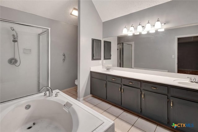 106 Hamlet Ct, Victoria, TX 77901 - full bath featuring double vanity, a bath, vaulted ceiling, and a stall shower