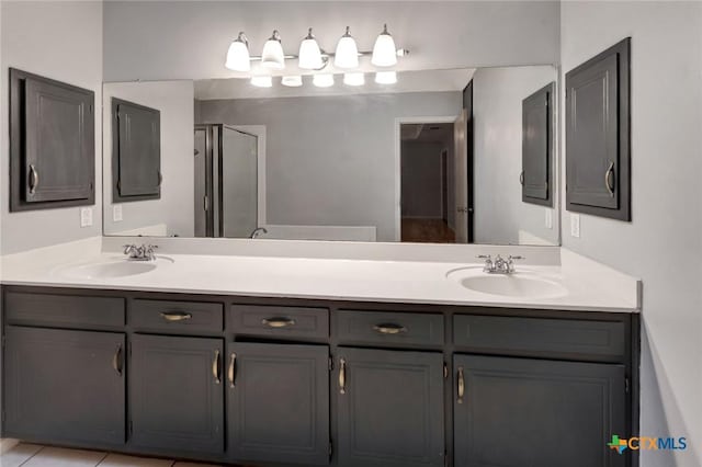 106 Hamlet Ct, Victoria, TX 77901 - bathroom featuring double vanity and a shower stall