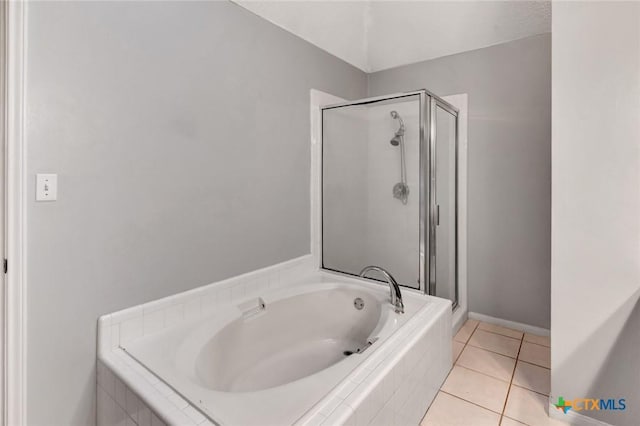 106 Hamlet Ct, Victoria, TX 77901 - full bath featuring a bath, a stall shower, and tile patterned flooring