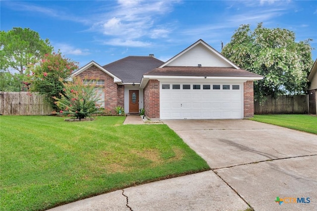 106 Hamlet Ct, Victoria, TX 77901 - traditional-style house with brick siding, concrete driveway, a garage, and roof with shingles