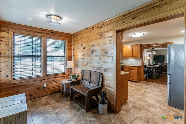 living area with wooden walls