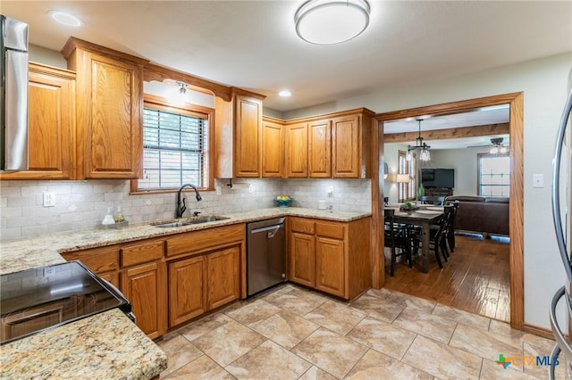 kitchen featuring decorative backsplash, black range with electric cooktop, brown cabinets, a sink, and dishwasher