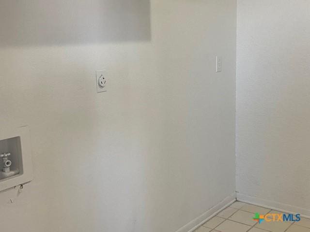 laundry room with light tile patterned floors