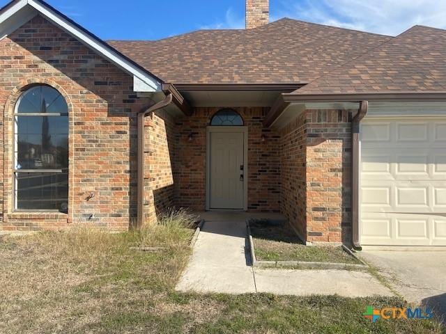 property entrance featuring a garage