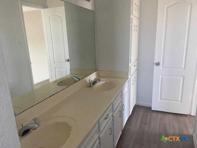 bathroom featuring hardwood / wood-style floors and vanity