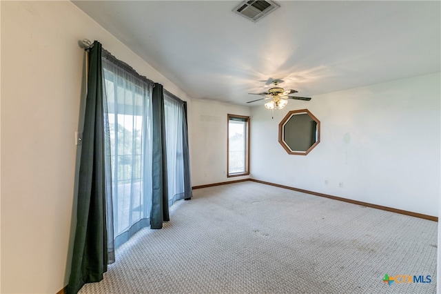 unfurnished room with light carpet and ceiling fan