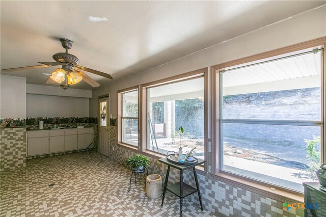 interior space featuring ceiling fan