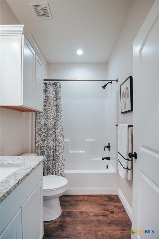 3611 Hanselman Rd, Victoria, TX 77901 - full bath with wood finished floors, vanity, toilet, shower / bath combo, and recessed lighting