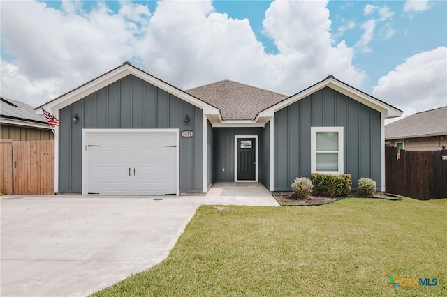 3611 Hanselman Rd, Victoria, TX 77901 - ranch-style house with board and batten siding, concrete driveway, an attached garage, and a shingled roof