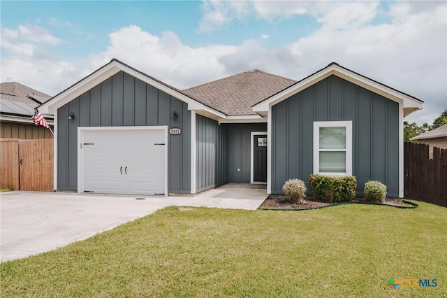 3611 Hanselman Rd, Victoria, TX 77901 - ranch-style house featuring board and batten siding, an attached garage, a shingled roof, and driveway