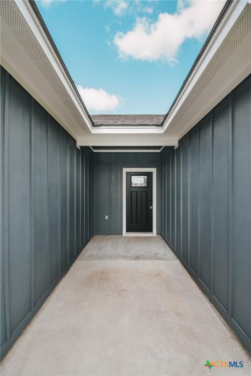 3611 Hanselman Rd, Victoria, TX 77901 - property entrance featuring board and batten siding and a patio