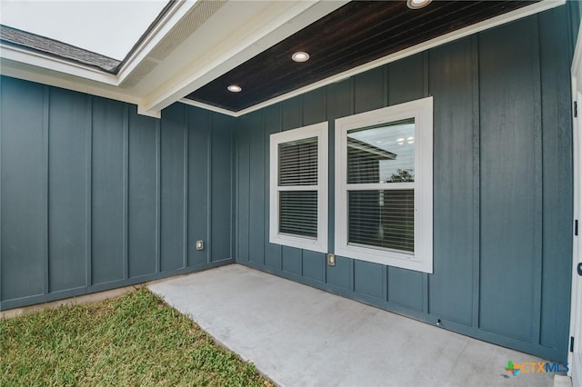 3611 Hanselman Rd, Victoria, TX 77901 - view of exterior entry featuring board and batten siding and a patio area