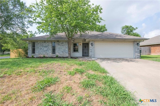 4812 Pepper Mill Holw, Killeen, TX 76542 - ranch-style house with an attached garage, driveway, and brick siding