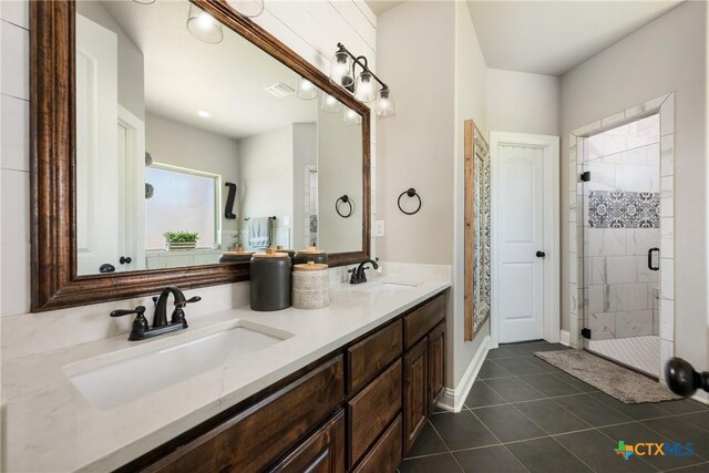 2015 Th Jones Mill Way, Salado, TX 76571 - bathroom featuring a stall shower, tile patterned floors, and double vanity