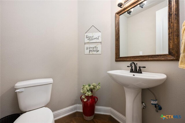2015 Th Jones Mill Way, Salado, TX 76571 - bathroom featuring toilet, baseboards, and wood finished floors