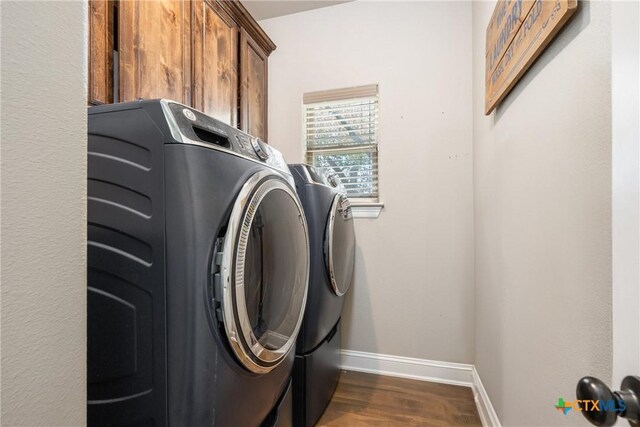 2015 Th Jones Mill Way, Salado, TX 76571 - washroom with separate washer and dryer, baseboards, dark wood finished floors, and cabinet space