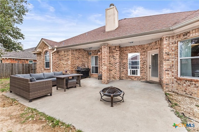 view of patio / terrace featuring an outdoor living space with a fire pit, a grill, and fence